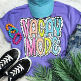 Vacay Mode Dalmation Dots Screen Print Heat Transfer - Colorful Dalmation Dot Pattern on a T-shirt with casual shoes, denim shorts, and accessories.