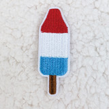 INDIVIDUAL Patriotic Popsicle Embroidered HAT/POCKET Patch, colorful embroidered patch resembling a patriotic popsicle with red, white, and blue sections and a brown stick, suitable for hats or pockets.