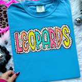 Leopards Dalmatian Dots DTF Heat Transfer, colorful animal print heat transfer design on a blue t-shirt.