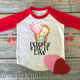 Prickly Kind of Love Sublimation Transfer, a white and red raglan shirt featuring a cute illustration of a hedgehog holding a pink cactus heart, with the text 'Prickly Kind of Love' below the image.