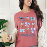 Kentucky Derby Blue Bows DTF Heat Transfer, a woman's pink T-shirt decorated with blue bows, cowboy boots with blue bows, and the text 'Kentucky Derby' in blue script.