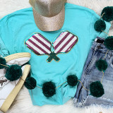 Pickle Ball Double Paddles Sequin Patch, colorful sequin patch with two pickleball paddles design on a turquoise t-shirt.