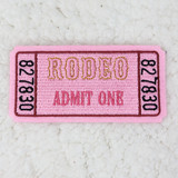 Rodeo Ticket Embroidered HAT/POCKET Patch, pink fabric patch with embroidered yellow, black, and pink ticket design and text.