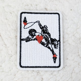 Rodeo ACE Embroidered HAT/POCKET Patch, embroidered patch featuring a figure holding a flag with a heart design, on a white background.