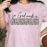 So God Made A GrandGrand DTF Heat Transfer, floral patterned text design on pink T-shirt.