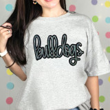 Bulldogs Sequin Patch, the image showcases a woman wearing a casual gray T-shirt with a 'bulldogs' sequin patch design on the front.