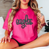 Eagles Sequin Patch, close-up of a pink T-shirt with a black sequined eagle patch design.