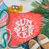 Sunseeker White PUFF Screen Print Heat Transfer, white puff print design with sunburst effect on coral-colored fabric