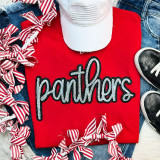 Panthers Sequin Patch, glittering black and white sequin embroidery of the word 'panthers' on a red t-shirt.