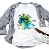 T-rex short arms Yeah B!tch Now What? sublimation transfer t-shirt, featuring a colorful cartoon T-rex dinosaur with the text 'Yeah Bitch, Now What?' in black writing.