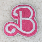 Barbie 'B' Embroidered HAT/POCKET Patch, pink and white embroidered patch in the shape of a letter B with decorative curls.