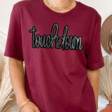 Touchdown Sequin Patch, embroidered 'touchdown' text with black outline and sequin details on a maroon T-shirt.