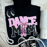 Light Pink Sequin Dance Mom Patch, close-up of black t-shirt with pink and black sequin dance-themed patch, featuring a dancer's shoes and bow, accessorized with earrings, faux pearl necklace, and a white water bottle with animal print design.