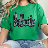 Bobcats Sequin Patch, a colorful and sparkly embellishment on a green t-shirt featuring the word 'bobcats' in stylish cursive with sequins.