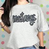 Mustangs Sequin Patch, a decorative patch with shiny sequins spelling 'mustangs' on a grey t-shirt.