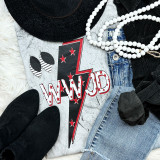 WWJD Screen Print Heat Transfer, patriotic themed apparel with red, white, and black design, featuring stars and text, placed alongside denim jeans, black hat, black shoes, beads, and black clothing items.