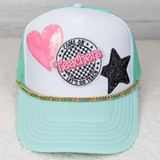 Chunky Colorful Enamel Gold Hat Chain, a pastel blue and white baseball cap with embroidered patches of a pink heart, a star, and a circular patch with the words 'Come on, let's go teach' and 'Teachers' in pink and black.