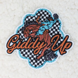 Giddy Up (HORSE) Embroidered HAT/POCKET Patch, embroidered patch featuring a boy riding a horse with the text 'Giddy Up' in orange, against a black and white checkered background.