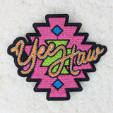 Yee Haw Western Embroidered HAT/POCKET Patch, colorful patch with the words 'Yee Haw' in cursive embroidery, pink background with decorative geometric elements in blue and green.