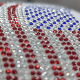 Rhinestone American Flag HAT/POCKET Transfer, close-up of red, white, and blue rhinestones arranged in the pattern of the American flag on fabric.