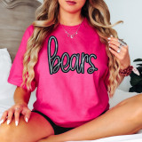 Bears Sequin Patch, close-up view of a pink woman wearing a t-shirt adorned with black and silver sequin Bear patches on the front.