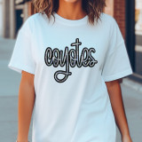 Coyotes Sequin Patch, glittery black sequin patch spelling out 'Coyotes' on a white t-shirt worn by a woman.
