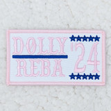 Dolly Reba '24 Embroidered HAT/POCKET Patch, a pink and white fabric patch with embroidered text and stars, featuring the name Dolly Reba and the number 24 in pink and blue decorative stitches.