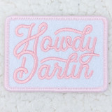 Howdy Darlin PINK Embroidered HAT/POCKET Patch, pink embroidered patch with the brand name 'Howdy Darlin' stitched in cursive on a white background with a pink border.