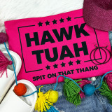 Hawk Tuah BLACK Screen Print Heat Transfer, pink fabric with black printed design and text, decorative colorful yarn balls, and accessories.