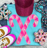Pink Sequins Candy Canes Patch, pink sequin candy canes decoration on a blue T-shirt surrounded by holiday accessories.