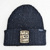 I'm Not Weird I'm Limited Edition FAUX Leather Patch beanie, black knit beanie with white specks and a beige leather patch featuring the slogan