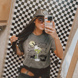 Witches Brew DTF Heat Transfer, Halloween themed graphic T-shirt featuring a cauldron, moon, black cat, and spell book design.