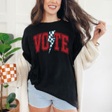 Vote Lightning Bolt DTF Heat Transfer, woman wearing a black shirt with the word 'VOTE' and a lightning bolt graphic, used for custom heat transfer designs.