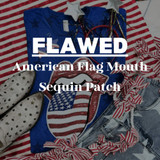 Flawed American Flag Mouth Sequin Patch, distressed patch with American flag design and mouth shape detailing, on a blue T-shirt with patriotic accessories.