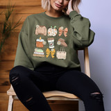 Fall Girly DTF Heat Transfer, illustration of autumn-themed items including a sweater, apple, bow, candle, coffee, boots, books, and tote bag decorated with flowers.