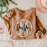 Mimi Fall Brushstrokes DTF Heat Transfer, graphic design on a folded beige sweatshirt with a circular brushstroke pattern, dotted letters, and a heart rate line.