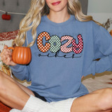 Cozy Vibes Dots DTF Heat Transfer, colorful polka dot design spelling out 'cozy' on a blue sweatshirt.