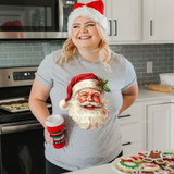 Classic Santa DTF Heat Transfer, festive Christmas-themed print of Santa Claus with holly on his hat on a woman's t-shirt.