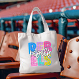Rebels Colorful DTF Heat Transfer, a vibrant multicolor design on a white tote bag, showcasing bold and playful lettering for customizable apparel and accessories.