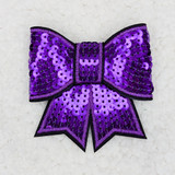PURPLE Sequin Bow HAT/POCKET Patch, a decorative patch featuring a large purple bow adorned with shiny sequins on a light background.