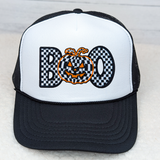 Checkerd BOO Embroidered Hat with Pocket Patch, black and white trucker cap with a pumpkin face embroidery on the front, decorative patch design for fall or Halloween.