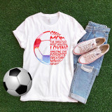 Soccer Mom Sweet Amazing Psychotic Sublimation Transfer, white T-shirt with colorful soccer ball graphic and vibrant text design, paired with blue distressed jeans and peach canvas sneakers, laid out on green grass with a soccer ball