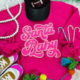 Santa Baby Sequin Patch, vibrant pink sequin embroidered patch with 'Santa Baby' text on pink clothing.