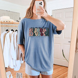 Simply Blessed Fall Dots DTF Heat Transfer, colorful and decorative design on a blue oversized t-shirt showing the phrase 'simply blessed' with fall-themed polka dot and dotted patterns.