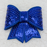 ROYAL BLUE Sequin Bow HAT/POCKET Patch, a decorative royal blue fabric bow adorned with shiny sequins and detailed stitching.