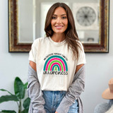 Metastatic Breast Cancer Awareness DTF Heat Transfer, a woman wearing a white T-shirt with a colorful rainbow design and the text 'Metastatic Breast Cancer Awareness'.