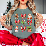 Vintage Christmas Coquette DTF Heat Transfer, Christmas-themed holiday decoration with festive icons including gingerbread man, Santa, snowman, candy canes, and gift box on a gray T-shirt.