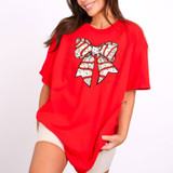 Snack Cake Bow DTF Heat Transfer, illustrated image of a festive bow with holiday candy cane and Christmas lights pattern on a white background.