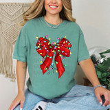 Christmas Light Bow DTF Heat Transfer, colorful festive Christmas light bow design on a teal T-shirt.