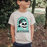 Bad To The Bone DTF Heat Transfer, graphic of a skull wearing a backwards cap with checkered background and the text 'Bad To The Bone'.